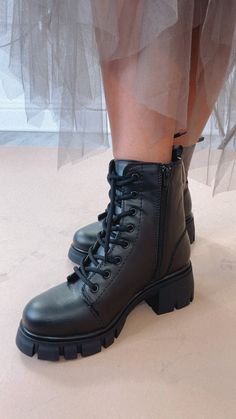 Step into urban chic with our High Street Combat Boot in Black. These boots seamlessly blend style and functionality, adding an edgy flair to your look while providing the comfort and durability needed for any adventure. Combat boot Lace up Platform boot Black Zipper up the side Need help with sizing? No problem! Join our VIP group on Facebook, Everyday Chic Boutique VIP Insiders to chat directly with our team and other customers just like you.Packaged with love and shipped from our warehouse in Wilmington, Ohio Black Lace-up Alternative Combat Boots, Black Ankle-high Combat Boots For Streetwear, Black Ankle-high Combat Boots With Reinforced Heel, Black Ankle-high Combat Boots With Zipper, Gothic High-top Combat Boots With Lug Sole, Black Platform Boots, Everyday Chic, Chic Boutique, Urban Chic