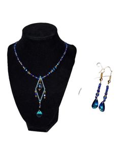 Add a touch of elegance to your collection with this stunning handmade jewelry set, featuring a dazzling blue necklace and matching earrings. This exquisite set is perfect for special occasions or adding a pop of color to your everyday attire. Necklace: Design: The necklace features a beautifully crafted diamond-shaped pendant adorned with sparkling blue beads and a central blue oval bead, surrounded by intricate gold accents. Length: Adjustable chain for a perfect fit. Materials: High-quality b Elegant Blue Round Bead Jewelry, Blue Pendant Necklace For Celebration, Blue Dangle Necklaces For Formal Occasions, Elegant Turquoise Jewelry For Celebration, Elegant Blue Necklaces For Celebration, Turquoise Beaded Jewelry For Celebration, Blue Dangle Jewelry For Celebration, Elegant Turquoise Necklace For Party, Party Jewelry With Turquoise Dangling Beads