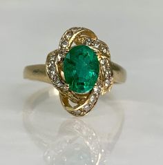 vintage emerald ring, emerald jewelry, emerald ring vintage, emerald gold ring, emerald diamond ring, 14k emerald ring, 14k vintage ring A distinctive vintage emerald ring featuring an oval cut center stone weighing 1.28 carats accented by 0.73 carats of diamonds set in a solid 14k gold. *Ring size: US 7 1/4 *Ring weight: 4.29 Grams *Center stone dimensions: 8X6mm Art Deco Green Emerald Ring In 14k Gold, Art Deco Emerald Ring In 14k Gold, Antique Emerald Cut Green Emerald Ring, Antique Green Emerald Cut Ring, Antique Green Emerald Cut Emerald Ring, Antique Green Emerald-cut Emerald Ring, Vintage Emerald Diamond Ring In Green, Antique Green Emerald Ring In 14k Gold, Antique 14k Gold Green Emerald Ring