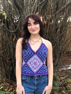 This halter top has a great 70's vibe with a little Alice in Wonderland too! Made of 5 granny squares, two granny triangles and great braided ties! Hippie Sleeveless Crop Top For Music Festival, Fitted Hippie Halter Crop Top, Hippie Sleeveless Halter Top For Music Festival, Purple Halter Neck Crop Top, Hippie Halter Neck Crop Top, Halter Neck Top For Music Festival, Hippie Style Fitted Sleeveless Vest, Fitted Sleeveless Hippie Vest, Festival Multicolor Vest Top