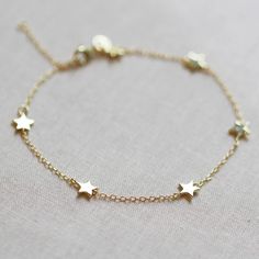 Our star bracelet is the perfect celestial addition to your bracelet stack. It features six tiny little stars that hang along delicate chain. DETAILS 6 inches long with 2 inch extender gold vermeil or .925 sterling silver Silver Star Bracelet, Stars Bracelet, Lunar Jewelry, Gold Bracelet Simple, Small Stars, Cheap Bracelets, Preppy Jewelry, Gold And Silver Bracelets, Small Bracelets