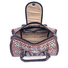 Our stunning cross-body bag is ready to have you turning heads. The intricate embroidery, featuring traditional Indonesian designs lends to its beauty, while its generous size makes for a gorgeous everyday handbag. The Nano Bag is not only beautiful, but it's 100% cruelty-free. Whether you are vegan or looking for ethical and artisanal-made, the Nano Bag is a top choice for the conscious consumer. 
      Snap button closure on the exterior front.  Three pockets including one zippered in the cott Luxury Embroidered Travel Bags, Traditional Satchel For Travel, Luxury Embroidered Crossbody Bag, Bohemian Satchel With Top Carry Handle, Traditional Travel Bag With Top Carry Handle, Traditional Shoulder Bag With Removable Pouch, Traditional Tote Bag With Top Carry Handle, Traditional Top Handle Satchel For Daily Use, Traditional Everyday Bags With Top Carry Handle