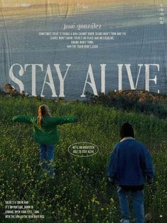 the movie poster for stay alive with two people standing in tall grass and looking out to sea