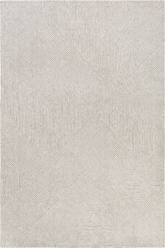 a white rug with an abstract design on the bottom, and a diamond pattern in the middle