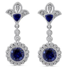 Two dazzling round cut medium blue sapphires are bezel set in this unique royal style drop down earring mounting with round cut diamonds and hand engraved fine milgrain accents. 
 
  These earrings are custom made to order and can be modified to fit your needs  .      MAIN GEM   Gem: Sapphire 
 Shape: Round 
 Carat Weight: 6ctw 
 Size: 7mm 
 Color: Medium Blue Dark Blue 
 Clarity: 
 Earring Style: Screw Back 
 Earring Style: Screw Back    ACCENT STONES   Gem: Diamond 
 Shape: Round 
 Carat Weight: 1.00ctw 
 Color: H 
 Clarity: SI1    ADDITIONAL INFORMATION   Style #: ER201 
 Additional Information: These earrings are customizable and can be modified to fit your needs Royal Style, Blue Sapphire Diamond, Best Diamond, Style Earrings, Screw Back Earrings, Royal Fashion, Sapphire Diamond, Round Cut Diamond, Bridal Accessories