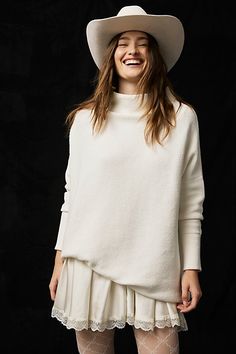 **Fit:** For a more tailored fit, size down. Heavy knit ribbed tunic sweater featured in a slouchy, oversized fit. * Stretchy fabric * Sleek mock neck | Ottoman Slouchy Tunic by Free People in White, Size: XS Oversized Funnel Neck Sweater For Spring, Chic Textured Knit Sweater With Funnel Neck, Ribbed Relaxed Fit Knit Top For Winter, Winter Ribbed Knit Top With Relaxed Fit, Oversized Ribbed Knit Top For Fall, Chic Winter White Sweater With Relaxed Fit, Modern Winter Tops For Loungewear, Modern Tops For Winter Loungewear, Winter White Oversized Tops For Layering