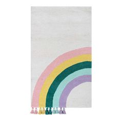 a white rug with rainbows and tassels on the bottom in front of a white background