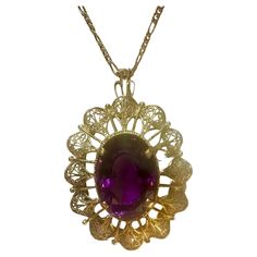 Approximately 23 Carat Amethyst Pendant in 18 Karat yellow gold with 14 Karat Yellow Gold Chain Necklace Vintage This spectacular Pendant Necklace consisting of a single large Oval Cut Amethyst , approximately 23 Carat. The Amethyst is surrounded by a intricate design of gold frame. 18 Karat gold 20 Grams with stone 14 Karat yellow gold chain is 3.8 gm The pendant comes with a 14 Karat Yellow gold Chain length of the 18 Inch Cut: Oval Pendent height approximately 2.5 inches pendent width approximately 1.5 inch Color of the amethyst is Very Pretty, very desirable I did not take professional pictures, all pictures are from my phone. Actual piece is prettier as my phone pictures can not do justice with the item. It's an Estate piece so all measurements and Weight of the stones are approximate Formal Amethyst Oval Cabochon Jewelry, Formal Amethyst Jewelry, Oval Cabochon, Formal Purple Oval Cabochon Jewelry, Oval Fine Jewelry Necklace For Collectors, Oval Amethyst Jewelry Collectible, Fine Jewelry Oval Necklace For Collectors, Exquisite Oval Necklace With Large Pendant, Luxury Amethyst Jewelry Stamped 14k, Luxury 14k Stamped Amethyst Jewelry