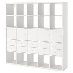 a white bookcase with many drawers on it