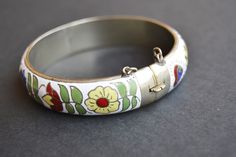 vintage enamel bracelet thailand Collectible Enamel Bracelet Jewelry, Antique Enamel Bracelet Collectible, White Enamel Bohemian Jewelry, Bohemian Enamel Bangle Bracelet, Bohemian Enamel Bangle Bracelets, White Bohemian Enamel Jewelry, Vintage Multicolor Enamel Bangle, Handmade Vintage Style Enamel Ring, Vintage Handmade White Cuff Bracelet