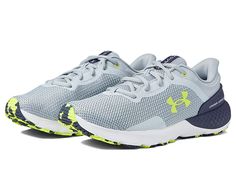 Under Armour Charged Escape 4 - Men's Shoes : Mod Gray/Tempered Steel/Yellow Ray : Look sporty and stay comfortable wearing the Under Armour Charged Escape 4 Shoes. Textile and synthetic upper. Textile lining and insole. Traditional lace-up closure. Round toe silhouette. Molded comfort collar and external heel counter for additional support. TPU midsole shank for added stability support. Synthetic outsole. Imported. Measurements: Weight: 10 oz Product measurements were taken using size 9, width Gray Lace-up Sneakers, Comfortable Lace-up Running Shoes With Arch Support, Sporty Under Armour Sneakers With Arch Support, Casual Under Armour Sneakers With Arch Support, Under Armour Low-top Running Shoes With Arch Support, Under Armour Running Sneakers With Arch Support, Under Armour Sneakers With Arch Support For Running, Under Armour Low-top Sneakers With Arch Support, Under Armour Synthetic Running Shoes With Arch Support