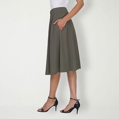 Strut or twirl with confidence in this light and breezy flared skirt. Perfect for keeping cool on a hot summer's day or for adding a touch of style whether you're off to work or a night on the town, this polyester and spandex skirt is as versatile as it is alluring.Front Style: Flat FrontFeatures: Stretch FabricClosure Type: Full ElasticPockets: 2 Side Slip PocketsRise: Mid RiseApparel Length: 23 InchesFiber Content: 95% Polyester, 5% SpandexFabric Description: KnitLining: UnlinedSkirt Length: Spring A-line Bottoms With Elastic Waistband, Casual A-line Voluminous Skirt, Stretch A-line Bottoms In Solid Color, Chic Stretch A-line Skirt, Fitted A-line Summer Skirt, Summer Workwear Knee-length Skirt, Summer A-line Bottoms With Elastic Waistband, Casual A-line Bottoms For Day Out, Stretch A-line Bottoms With Elastic Waistband