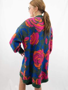 This Oversized Floral Cardigan is in a delightful palette of hunter green, pink, blue, and orange hues. It features a charming floral pattern and comes in an oversized fit for a cozy and stylish look. With the added convenience of pockets, it's the perfect combination of fashion and functionality. Pair it with leggings or a t-shirt dress. SIZE & FIT Oversized fit Model is 5'6" wearing size small Green Floral Print Fall Outerwear, Green Floral Print Outerwear For Fall, Bohemian Floral Print Winter Cardigan, Vintage Floral Print Cardigan For Fall, Fall Vintage Floral Print Cardigan, Winter Green Floral Print Sweater, Bohemian Floral Print Sweater For Fall, Oversized Multicolor Floral Print Outerwear, Colorful Oversized Fall Outerwear