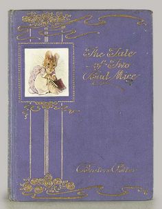 an old purple book with gold trimmings and a mouse on the front cover