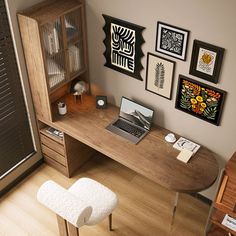 a computer desk with a laptop on top of it next to a wooden cabinet and white stool