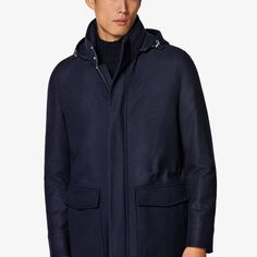 A richly layered
  piece made to keep you warm in luxury, this navy parka
  puts a tailored spin on a classic winter layer and brings adaptable features
  like a removable inner layer and cinching drawstring Luxury Navy Wool Outerwear, Classic Parka With Detachable Hood For Fall, Classic Fall Parka With Detachable Hood, Classic Parka With Detachable Hood For Cold Weather, Luxury Parka With Detachable Hood For Cold Weather, Navy Outerwear With Detachable Hood For Fall, Fall Navy Hooded Jacket With Detachable Hood, Navy Hooded Jacket With Detachable Hood For Winter, Navy Winter Hooded Jacket With Detachable Hood