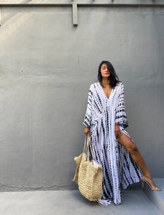 "\"Uluwatu Kaftan dress\" Soft, Smooth, Lightweight Rayon voile Fabric. Perfect for Elegant Day and Nightwear or worn as a cover-up for that beach or poolside statement of glamour. And for Muslim women Color - Hand Tie Dyed White & Black Measurements in CM and Inches. Size American measurement Medium to Large. It fits to all the body size between M to2XL Size - One size fits all American size From S to 2XL Total wide /240cm/94inch(round) Chest & him /180cm/70inch(round) The length /150cm Flowy V-neck Kaftan For Day Out, Hippie V-neck Free Size Maxi Dress, Flowy Boho Sundress For Beach Cover-up, Bohemian V-neck Kaftan For Vacation, White Free Size Maxi Dress For Beach Cover-up, Hippie Beach Cover-up Dress With Kimono Sleeves, White V-neck Bohemian Kimono, Flowy Dress With Kimono Sleeves For Day Out, Free Size Boho Maxi Dress For Beach Cover-up