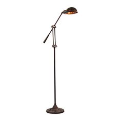 a black floor lamp with an orange light on the top and one arm in front of it