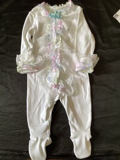 Beautiful Spanish style all in one Spring Playtime Stretch Onesie, Spring Stretch Onesie For Playtime, Spring Playtime Onesie With Stretch, Spring Onesie For Playtime With Stretch, White Spring Bodysuit For Bedtime, Fitted Long-sleeved Onesie With Ruffles, Fitted Long Sleeve Onesie With Ruffles, White Ruffled Onesie For Playwear, Spring White Ruffled Onesie