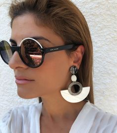 A unique pair of women earrings in hoop shape in black and white colors that open and closes with clip. Find Them only at Christina Christi Store. 👉 My Earrings Collection: https://etsy.me/2UiXmKR 👉 Express Shipping: https://etsy.me/3ikUnOM DIMENSIONS - Round Earrings Have Length 9,5 cm (3.7''). MATERIALS - Metal Parts. - Plexiglass Parts. - Marble Stone. Social Media *Facebook Page: @ChristinaChristiJewels *Instagram Profile: @christina_christi_jewels ##NEW DHL EXPRESS SHIPPING ADDED## EU EST Trendy White Metal Earrings, Modern White Hoop Jewelry, Modern White Clip-on Jewelry, White Minimalist Metal Hoop Earrings, Trendy White Metal Clip-on Earrings, Trendy White Pierced Earrings, Modern White Metal Hoop Earrings, Modern White Clip-on Earrings, Trendy Single White Earring