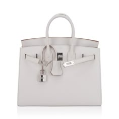 Mightychic offers an Hermes Birkin Sellier 25 bag featured in gorgeous soft Mauve Pale. Perfectly complimented with Palladium hardware. This exquisite bag is modern and minimalist. A sleek pared down version that exudes chic sophistication. Epsom leather with the signature sellier edges create a work or art. Comes with the lock and keys in the clochette, sleepers, signature Hermes box. NEW or NEVER WORN. final sale BAG MEASURES: LENGTH 25 cm / 9.75" TALL 18.5 cm / 7.25" DEEP 13 cm / 5.25" HANDLES: TALL 3" CONDITION: NEW or NEVER WORN Hermes Diamond Bag, Birkin 25 Sellier, Hermes Birkin Sellier, Birkin Sellier, Hermes Birkin Bag, Luxury Bags Collection, Hermes Birkin 25, Crocodile Bags, Hermes Box