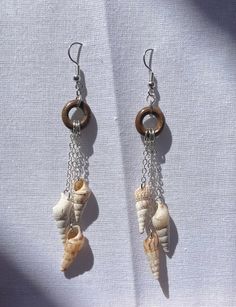 Handmade earrings made from shells, chain, and a wooden hoop. These mini wind chimes are perfect for summer or any beach day! Wind Chain, Wooden Hoop, Beach Day, Handmade Earrings, Wind Chimes, Jewelry Earrings Dangle, Etsy Earrings, Dangle Drop Earrings, Shells