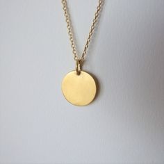 "This minimalistic 14k gold pendant is unisex and a perfect gift for a man. It is made of 14k gold and has an elegant matte finish. The pendant can be ordered by itself or with a chain necklace. You can choose the color of 14k gold of the pendant and the chain necklace will be made of- yellow or white gold. I plate the white gold with rhodium as common in white gold jewelry The diameter of the round pendant is 0.62 inches ( 1.6 cm ).  If you decide to order the pendant with the chain necklace yo 14k Yellow Gold Circle Necklace, Minimalist Everyday Charm Necklace With Coin Pendant, Everyday Minimalist Charm Necklace With Coin Pendant, Modern Yellow Gold Round Pendant Charm Necklace, Modern 14k Gold Round Pendant Necklace, Minimalist Medallion Jewelry For Everyday, Minimalist Round Disc Jewelry With Coin Pendant, Minimalist Gold Plated Oval Pendant Charm Necklace, Minimalist 14k Gold Medallion Jewelry