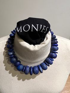 Beautiful original blue necklace by Danish design brand Monies from Copenhagen, Denmark. Necklace is as good as new. Barely worn a few times. Necklace dates from 2017. This 34 stones chain of pure natural lapis lazuli gems is very elegant. With a weight of 233 grams gram it feels very nice around the neck. Lapis lazuli is a very spiritual stone. It promotes spiritual strength, spiritual skills, astral travel, enlightenment, wisdom and gives inner peace and tranquility. The stone makes honest, si Handmade Blue Lapis Lazuli Necklace, Royal Blue Lapis Lazuli Necklaces With Round Beads, Royal Blue Lapis Lazuli Necklace With Round Beads, Blue Lapis Lazuli Round Necklace, Unique Blue Round Necklace, Unique Blue Gemstone Beaded Necklaces, Unique Blue Gemstone Beaded Necklace, Blue Lapis Lazuli Stone Necklace, Blue Lapis Lazuli Necklaces With Stones