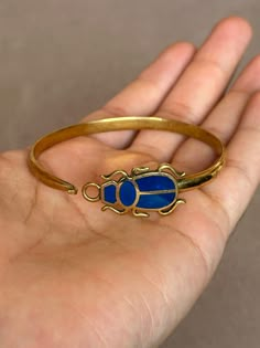 If You Can't Stop Thinking About ItBUY IT ;) The Gold Scarab Bracelet Inspired by ancient Egypt, this exquisite piece blends modern elegance with the timeless allure of the scarab beetle, a symbol of rebirth and protection. Perfect for both men and women, it's a captivating gift resonating with millennia of history and culture. Visit https://www.etsy.com/shop/egyptoriginals  for more handcrafted Ancient Egyptian Art Sculpture statues Egyptian Jewelry Modern, Egypt Jewelry Ancient, Egyptian Jewelry Ancient, Ancient Egypt Bracelet, Scarab Jewelry Ancient Egypt, Egyptian Jewellery, Egyptian Golden Jewelry, Egyptian Bracelet, Egypt Jewelry