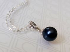 Dark Blue Navy Blue Colored Pearl Drop Silver Pendant Necklace with .925 Sterling Silver Chain. PLEASE READ ITEM DESCRIPTION and SHOP POLICIES before placing your order, and contact me with any questions! CHAIN is 18 inches (45.7cm) long. PENDANT is about 0.86 inch (2.2cm) long including bail. MATCHING EARRINGS: https://www.etsy.com/listing/266058103/navy-blue-pearl-earrings-dark-blue-pearl?click_key=18557cdb6347e9e280bafbe421ebf49ab2d4ffc2%3A266058103&click_sum=64a132e6&ref=shop_home_active_4&c Blue Round Pendant Necklace For Formal Occasions, Elegant Blue Round Pendant Necklace, Sapphire Pendant Necklace For Wedding, Formal Blue Round Pendant Necklace, Blue Pearl Pendant Jewelry For Wedding, Elegant Blue Pearl Pendant Necklace, Elegant Blue Pendant Pearl Necklace, Formal Blue Necklace With Pearl Pendant, Blue Pendant Pearl Necklace As Gift