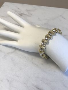 "18kt Yellow Gold Heavy Solid Lady's Cubic Zirconia (CZ) Bracelet 7\" in Length. This Bracelet consists of 18- 3mm, .10ct each , 1.80ctw Cubic Zirconia (CZ) all prong set in 14kt White Gold settings in a heavy solid 12mm wide hinged mounting. There is a hidden box clasp with a secure fig 8 safety clasp. These CZ's look so real. Total mounting weigh is 43.8 grams. This item would Retail for $6,550.00" Elegant Tennis Bracelet With Bling For Wedding, Luxury Gold Tennis Bracelet With Sparkling Stones, Gold Cubic Zirconia Tennis Bracelet Hand Set, Yellow Gold Cubic Zirconia Bracelet With Sparkling Stones, Yellow Gold Bracelets With Sparkling Cubic Zirconia, Gold Crystal Bracelet With Cubic Zirconia, Luxury Gold Crystal Tennis Bracelet, Gold Tennis Bracelet Hand Set Fine Jewelry, Yellow Gold Diamond Tennis Bracelet For Party