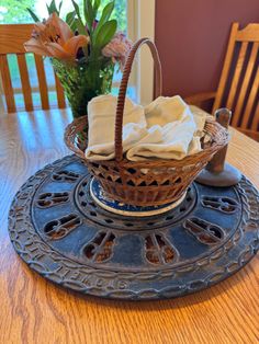 a wicker basket sitting on top of a wooden table