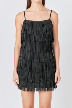 This Embellished Faux Suede Fringe Mini Dress is perfect for a night out on the town. With its sleeveless design, fringed detail, and embellished accents, this dress is sure to turn heads. Whether you're hitting up a club or going to a fancy dinner, this mini dress is a great choice. You'll look and feel fabulous in this amazing dress. Faux suede Adjustable straps Fringe detail torso Mini length Sleeveless Lined Hand wash cold Do not bleach Do not tumble dry Do not dry clean Do not iron Shell: 5 Suede Mini Dress, Black Fringe Dress, Fringe Mini Dress, Rhinestone Dress, Fancy Dinner, Fringe Dress, Black Fringe, Suede Fringe, Hip Length