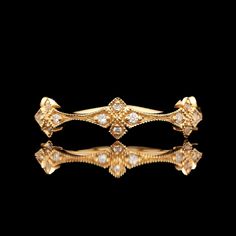 An 18k yellow gold diamond decorative band.  SR2535 Weight: 2.9 grams Size: 7 Diamond (20) Round Color: G-H Clarity: VS2-SI1 Carat Weight: 0.15 ctw Luxury 14k Gold Jewelry With Decorative Band, Luxury 14k Gold Diamond Ring, Luxury Gold Diamond Ring With Single Cut Diamonds, Luxury Gold Diamond Ring With Diamond Accents, Luxury Gold Diamond Ring With Accents, Elegant Yellow Gold Jewelry With Decorative Band, Luxury Jewelry With Decorative Band In 14k Gold, Luxury Gold Jewelry With Decorative Band, Elegant Gold Diamond Ring For Ceremonial Occasions