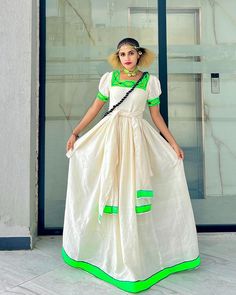 This vibrant green Habesha dress is a stunning representation of Ethiopian culture. Crafted with care, this Ethiopian traditional dress, known as a Habesha Kemis, showcases a rich, cultural design that’s perfect for special celebrations. Its lively green color adds a touch of modern elegance to this timeless piece. Material Cotton Thread Estimated delivery : 1 week to 2 weeks Contact WhatsApp +1(304)-306-2784Email: contact@ethiopian.store Green Maxi Length Traditional Wear With Cutdana, Traditional Handloom Festival Dress, Green Floor-length Traditional Wear With Cutdana, Bohemian Pista Green Dress For Festive Occasions, Traditional Handloom Maxi Dress For Festive Occasions, Traditional Floor-length Maxi Dress For Navratri, Bohemian Green Maxi Dress For Festivals, Green Bohemian Maxi Dress For Festivals, Festive Bohemian Pista Green Dresses