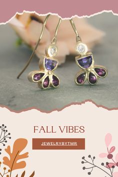 Embrace the intricate elegance of these unique gold earrings adorned with zircon, amethyst, and garnet. With their charming details and colorful drop-dangle design, they’re the perfect finishing touch for any evening ensemble. Thoughtful gift for her. Handmade with care, they bring a touch of artistry to any occasion.

#GemstoneJewelry #HandmadeJewelry #AmethystEarrings #GarnetEarrings #DangleEarrings #ChicJewelry #UniqueEarrings #ColorfulJewelry #Fallearing #AutumnAccessories #AutumnJewelry Gold-plated Yellow Gold Earrings With Gemstone Accents, Gold Plated Drop Earrings With Gemstone Accents, Gold Plated Earrings With Gemstone Accents, Purple Jeweled Dangle Earrings, Gold Earrings With Gemstone Accents Fine Jewelry, Gold Earrings With Gemstone Accents In Fine Jewelry Style, Unique Purple Jeweled Dangle Jewelry, Dangle Earrings With Gemstone Accents And Cubic Zirconia, Dangle Earrings With Gemstone Accents In Cubic Zirconia