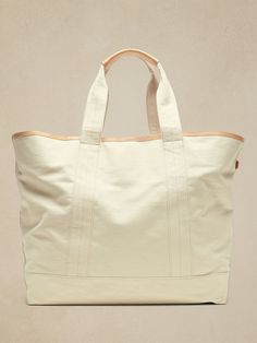 Ready for adventure, this sturdy tote bag is crafted from our sturdiest cotton canvas, with luxurious leather vachetta trim details so it will age gracefully with every outing.  Leather trim handles.  External slip pocket.  Magnetic tab closure.  Int Age Gracefully, Aging Gracefully, Large Canvas, Trim Detail, Leather Trim, Canvas Tote, Leather Trims, Cotton Canvas, Banana Republic