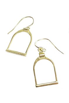 A classic English stirrup is beautifully hand cast in 14K gold vermeil. Modern, elegant and the weight is perfectly balanced. Classic equestrian beauty and a nod to English riders and style aficionados. 14 Karat Gold, Sterling Silver Stirrup Charm is .6" W x .9" L x .75" Drop Dangle Earring Handcrafted in India Ships from the USA Why do we love this earring? We love anything equestrian, and the styled stirrup icon is richly detailed and paired with 14k gold creates a gorgeous earring. Such a uni Classic Gold Jewelry With Brass Hardware, Classic Formal Jewelry With Brass Hardware, Elegant Horseshoe Earrings For Gift, Classic Horseshoe Jewelry, Stirrups, Earrings In Gold, Hand Cast, Gorgeous Earrings, Gold Vermeil