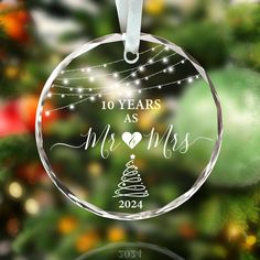 a glass ornament with the words 10 years as mr and mrs on it