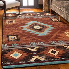 a brown and blue area rug in a living room