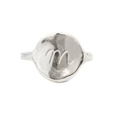 The Georgia Ring is a timeless signet ring, thoughtfully designed for effortless everyday wear. Its simple yet sophisticated silhouette embodies a sense of femininity and grace, with soft curves and a fluid, organic shape that moves naturally with the wearer. The design draws inspiration from the iconic artist Georgia O'Keeffe, renowned for her ability to capture the beauty of the natural world in its most abstract and evocative forms. Like O'Keeffe's work, the Georgia Necklace reflects a blend Timeless Everyday Initial Ring, Minimalist Initial Ring In Polished White Gold, Hand Forged Sterling Silver Signet Ring, Elegant Sterling Silver Hand Forged Signet Ring, Elegant Hand Forged Sterling Silver Signet Ring, Modern Everyday Initial Ring With Round Band, Minimalist Curved Jewelry With Polished Finish, Minimalist Hammered Signet Ring As Gift, Minimalist Hand Forged Engraved Promise Ring