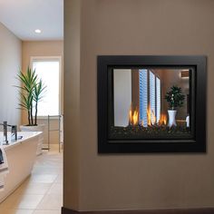 a bathroom with a bathtub and a fireplace in it