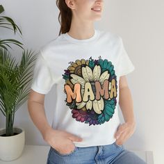 If you are a proud mama who loves retro vintage style print, this t-shirt is for you! This t-shirt features the words “Mama” in a cool font and a vintage flower design. This t-shirt is a great way to express your mom life and motherhood with a cute and fun shirt. You can wear it on Mother’s Day, your birthday, or any day you want to feel fabulous. This t-shirt is made from high-quality cotton and has a soft and comfortable fit. It comes in different sizes and colors to match your taste. Don’t mi Cool Font, Motherhood Shirts, Mama T Shirt, Fun Shirt, Mom Life Shirt, Retro Vintage Style, Mama Shirt, Mom Birthday, Cool Fonts