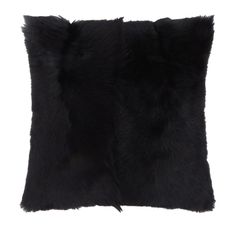 the black fur pillow is on display in front of a white background and it's dark