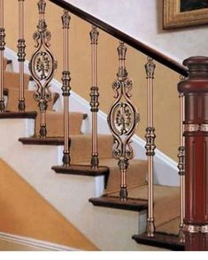 the stair railing is made of metal and wood