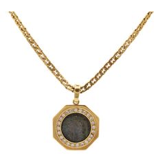 This is part of Chairish’s Fine Jewelry assortment.  Gender: Unisex  Metal Type: 18K Yellow Gold  Chain Length: 16.00 inches  Chain Width: 4.10 mm  Pendant Diameter: 28.00 mm  Pendant Weight: 14.12 Grams  Chain Weight: 25.94 Grams  18K yellow gold diamond vintage coin, halo pendant. The metal was tested and determined to be 18K yellow gold.  18K yellow gold vintage flat razor link chain. The metal was tested and determined to be 18K yellow gold. Engraved with "750".  Vintage in very good condition. Signs of wear are consistent with age.  Pavé set in 18 Karat Yellow Gold with:  Twenty-four (24) round brilliant cut natural diamonds:  Measurements: 1.75mm - 2.00mm in diameter x ~1.14mm in depth. Weight Range: 0.021 ct. - 0.030 ct. Estimated Total Weight: 0.620 ct. Color: I - J Clarity: VS2 - Formal Gold Plated Coin Pendant Jewelry, Formal Yellow Gold Coin Jewelry, Formal Fine Jewelry With Coin Pendant, Timeless Formal Coin Pendant Jewelry, Formal White Gold Coin Pendant Jewelry, Formal Yellow Gold Jewelry With Coin Pendant, Elegant Yellow Gold Coin Necklace For Anniversary, Formal Tarnish Resistant Round Pendant Necklace, Luxury Engraved Round Chain Necklace