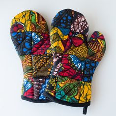 an oven mitt with colorful designs on it