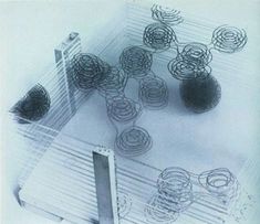 an aerial view of several circular objects in the middle of a room with lines on it