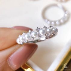 Highlight: Short Balance Ring Product Information OriginJapan MaterialAkoya Pearl, 18k Gold, and Natural Diamonds DimensionsCustomize Pearl Shaped: Round Size: 3-3.5 mm Quality: AAA Nacre: Very Thick Color: White Luster: Aurora Accessories Metal: 1.91 g of 18k White Gold Other: 0.12 ct of SI Quality Natural Diamonds Akoya Pearl Rings With Diamond Accents, White Akoya Pearl Rings With Diamond Accents, Fine Jewelry White Gold Pearl Ring With Prong Setting, White Pearl And Diamond Open Ring, White Gold Pearl Ring With Cubic Zirconia, White Gold Pearl Ring With Prong Setting, Fine Jewelry Akoya Pearl Diamond Ring With Accents, Akoya Pearl Diamond Ring With Accents, Akoya Pearl Diamond Ring With Diamond Accents