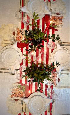 the table is decorated with red and white plates